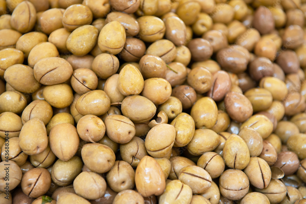 Salting olives sold on outdoor market, Sicily, Italy Salting olives sold on outdoor market, Sicily, Italy