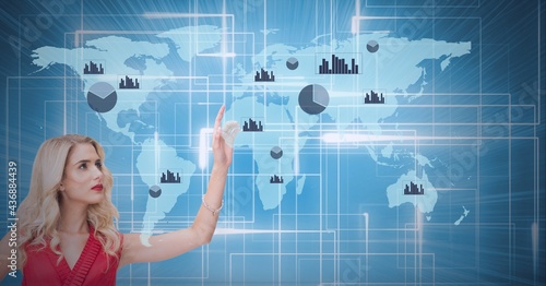 Composition of caucasian woman pointing to statistics, digital data processing and world map photo