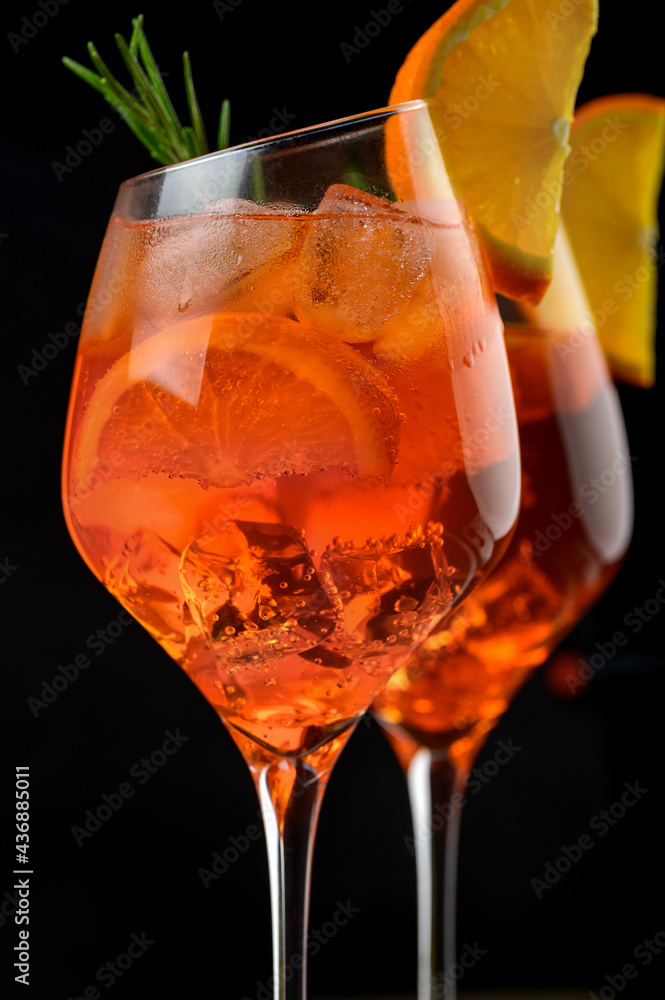 Wineglass of ice cold Aperol spritz cocktail served in a wine glass ...