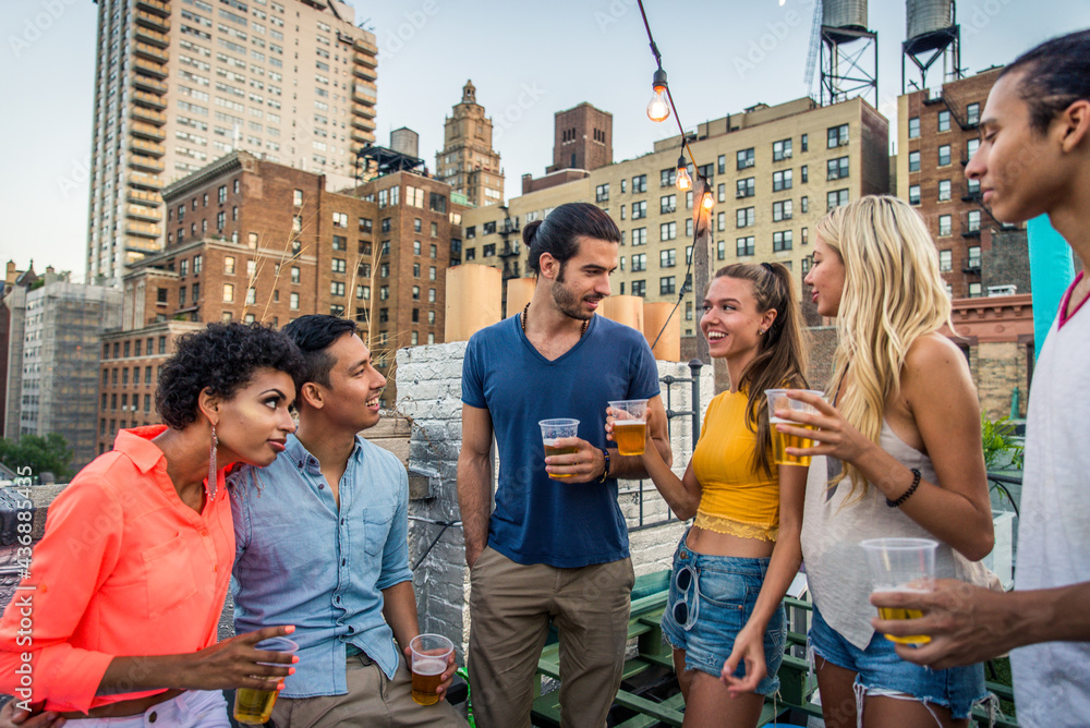 Group of friends having party on a rooftop Group of friends having party on a rooftop