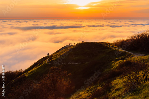 Fototapeta Naklejka Na Ścianę i Meble -  Sunset or sunrise with clouds on mountains with trails