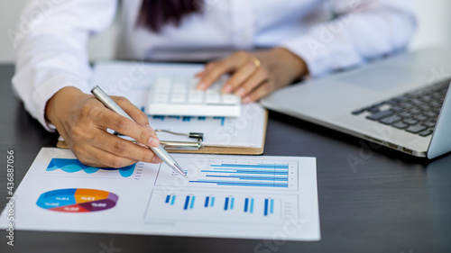Financial Businesswomen analyze the graph of the company s performance to create profits and growth  Market research report and income statistics  Financial and Accounting concept.