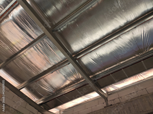 Obraz na plátně Aluminum foil sheets are used as thermal insulation of the roof