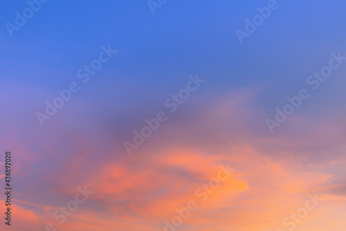 Clouds and sky in the evening,Sky blue and orange light of the sun through the clouds in the sky