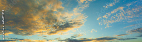 Clouds and sky in the evening,Sky blue and orange light of the sun through the clouds in the sky