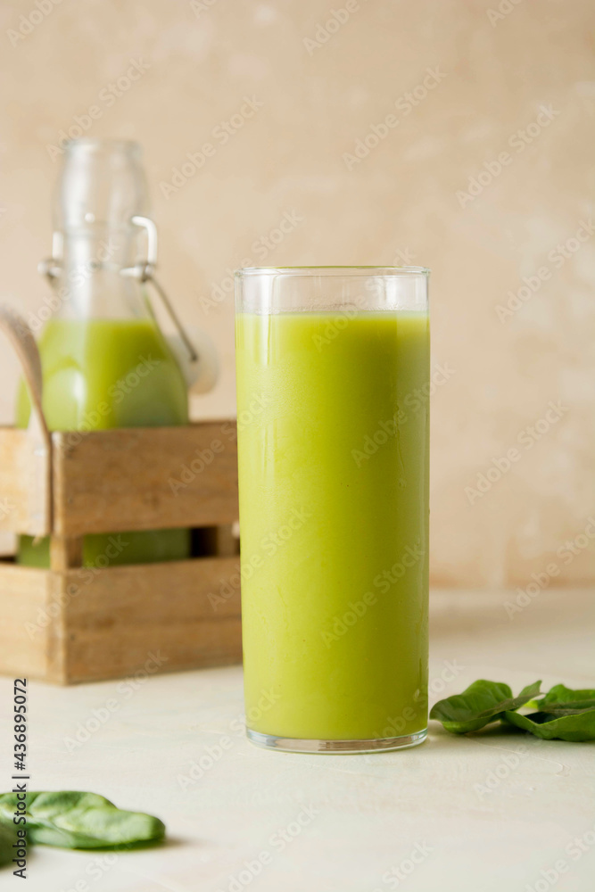 Smoothie with banana, spinach and lime. Healthy detox green drink glass. Smoothie with banana, spinach and lime. Healthy detox green drink glass.