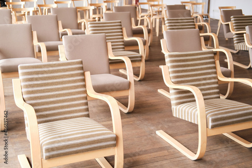 Close-up of empty chairs in modern conference hall