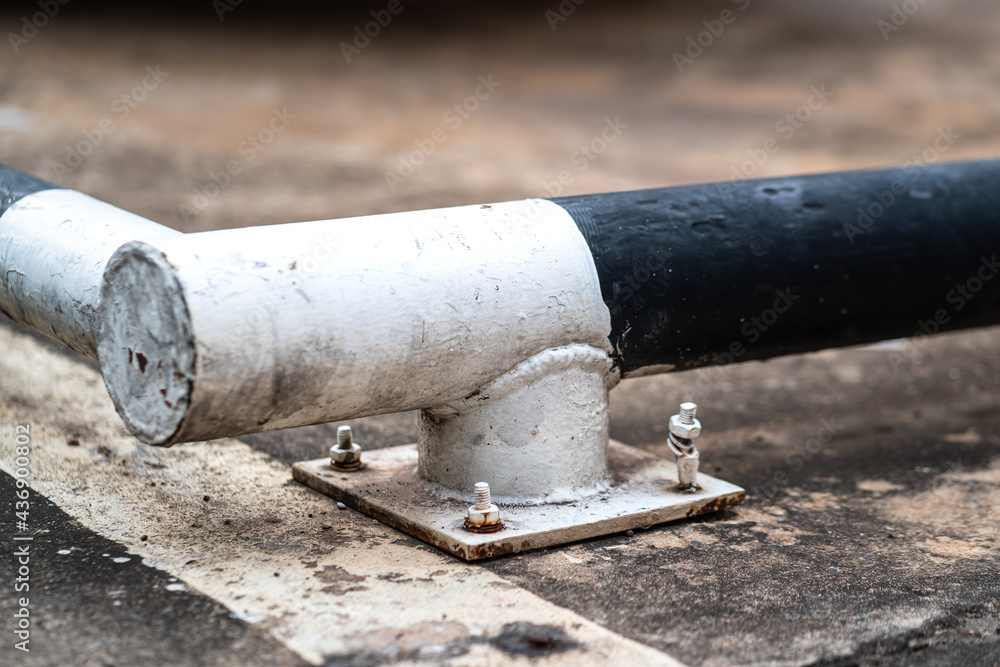 Part of metal rod building which is use as wheel stopper for heavy truck. Transportation safety equipment, close-up photo. Part of metal rod building which is use as wheel stopper for heavy truck. Transportation safety equipment, close-up photo.