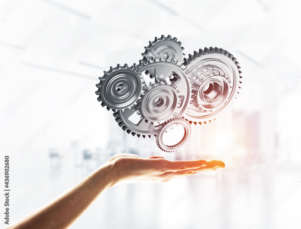 Concept of teamwork and cooperation presented with working gear engine