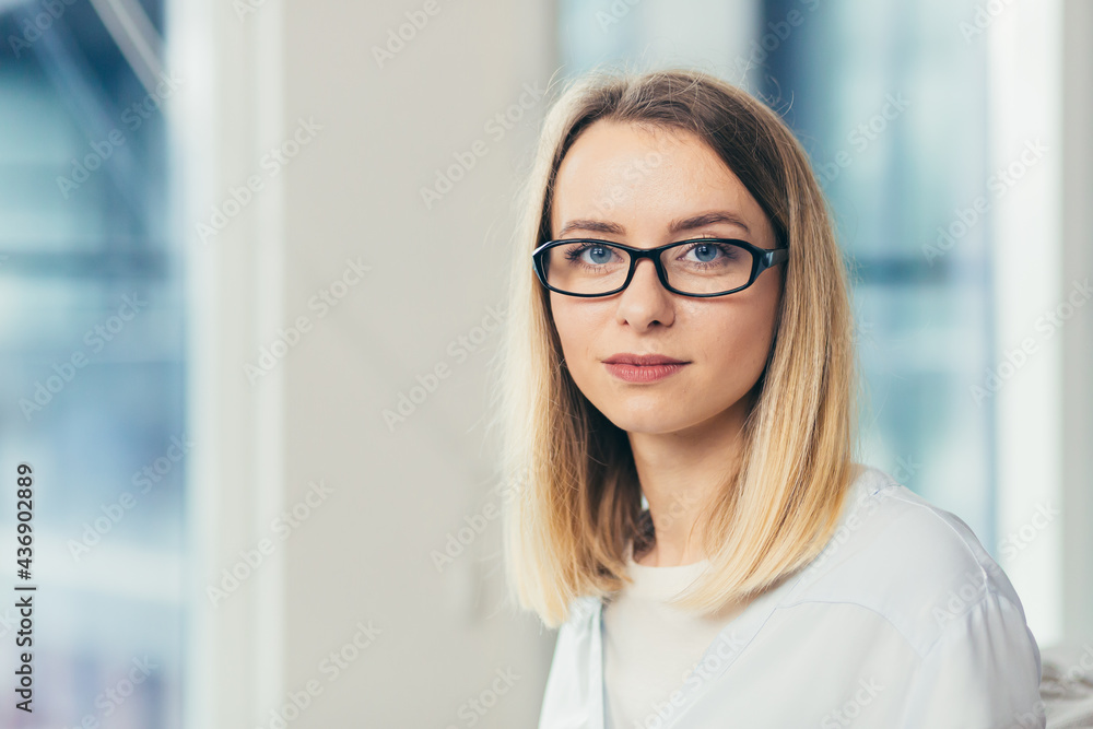 Portrait of a young female doctor looking at the camera and smiling Portrait of a young female doctor looking at the camera and smiling