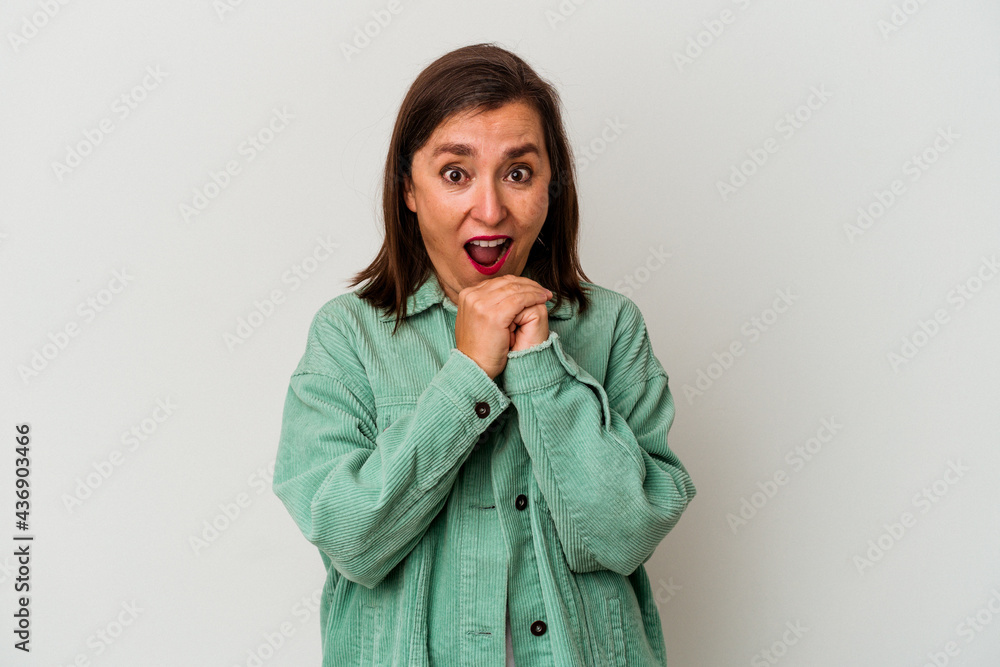 Middle age caucasian woman isolated on white background praying for luck, amazed and opening mouth looking to front. Middle age caucasian woman isolated on white background praying for luck, amazed and opening mouth looking to front.