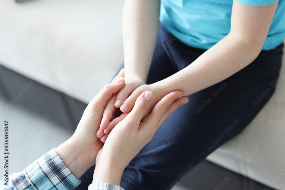 Palms of mother and girl are joined together Palms of mother and girl are joined together