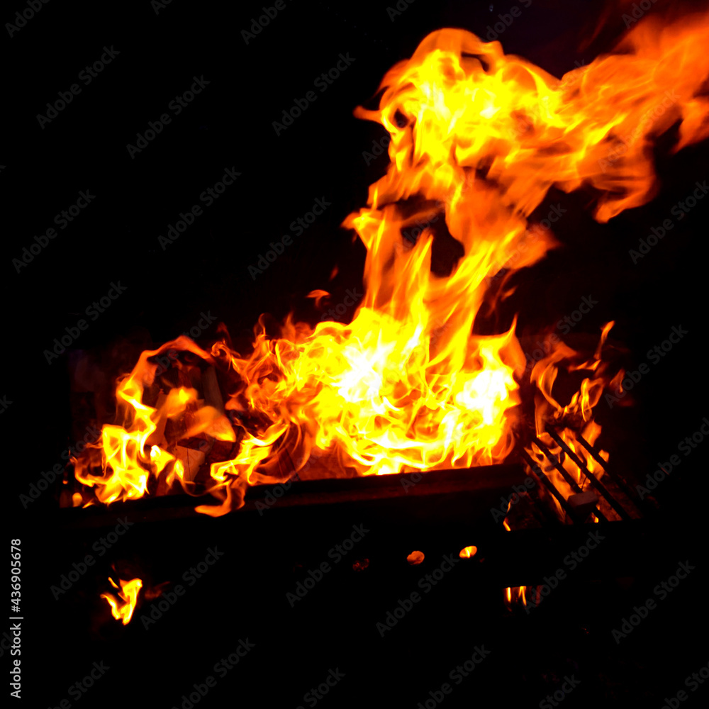 Fire in the grill, bright heat at night Fire in the grill, bright heat at night