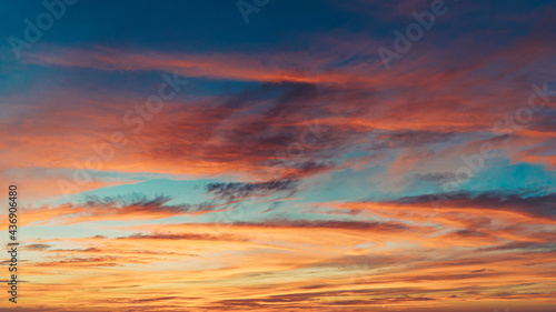 isolated shot of vibrant colored sky with clouds at sunset © RandomHartz