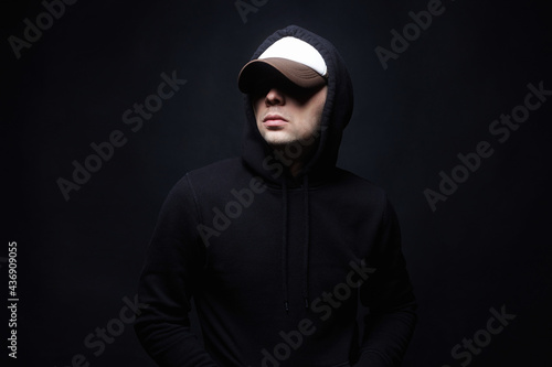Man in Hood and hat. Boy in a hooded sweatshirt