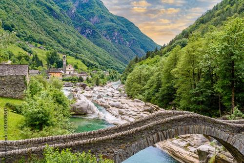 View of Bridge Ponte dei Salti to Verzasca River at Lavertezzo - clear and turquoise water stream and rocks in Ticino - Valle Verzasca - Valley in Tessin - Travel destination in Switzerland
