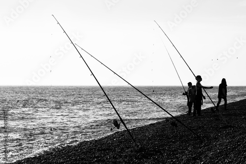 Black and White silhouette of fishing on the sea © mubus