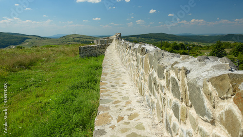 Standing on the ruins of a roman stone wall. The defensive fortification can be found in Zalau, Romania - the old Dacia province. Porolissum castrum guarded the northern borders of the Roman Empire. photo