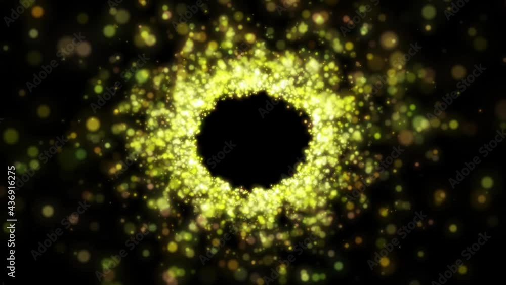 Shimmering gold particles against a black background formed a golden tunnel. Shimmering gold particles against a black background formed a golden tunnel.