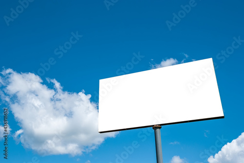 Fotografi White tabloid against a blue sky with beautiful clouds.