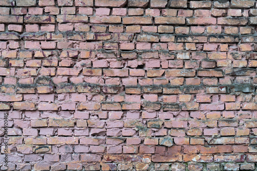 Dirty square brick wall abstract wallpaper background 