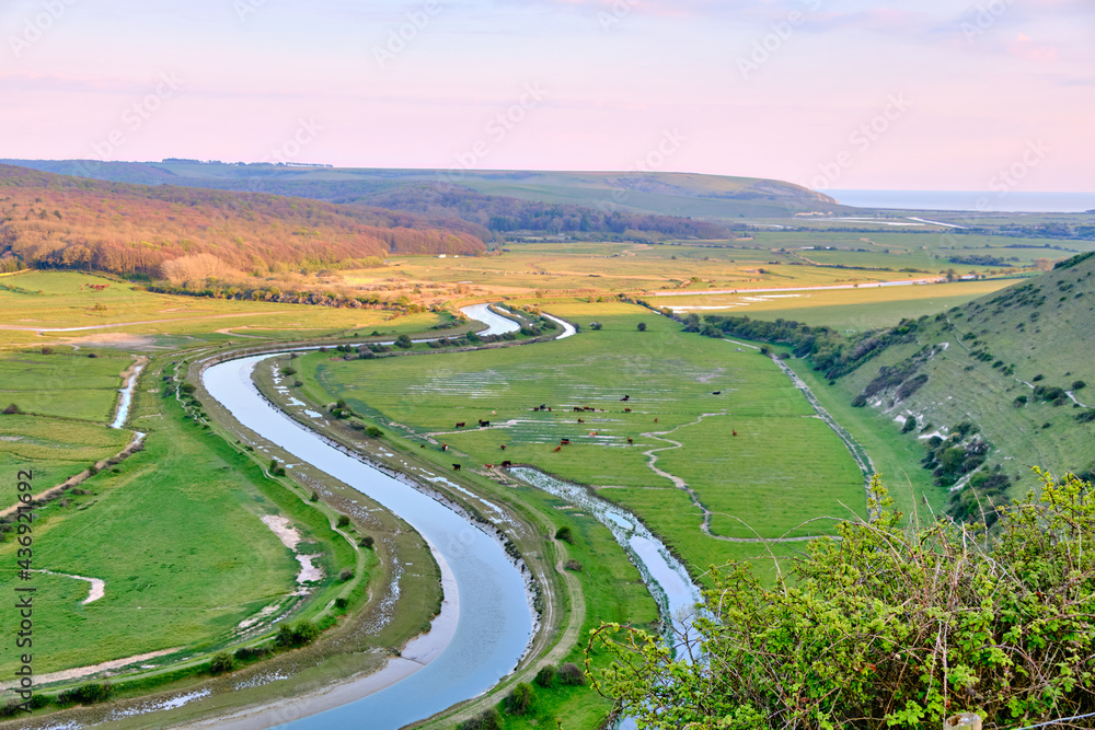 View of the meandering Cuckmere river and valley from the High and Over footpath, selective focus. West Dean, Seaford, East Sussex, England