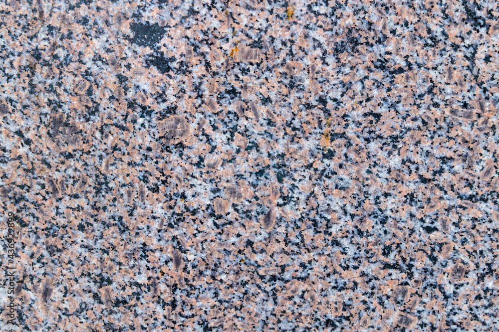Fototapeta premium Natural texture of gray and red granite stone. Construction material 