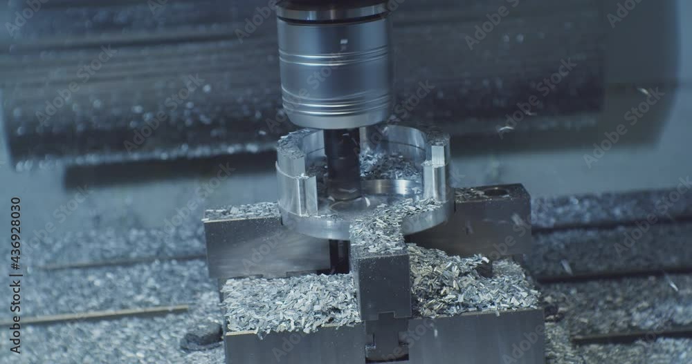 modern industrial equipment.Milling machine for cutting steel handles a piece of aluminum.The drill cuts the detail on the steel plate.technological process close-up. modern industrial equipment.Milling machine for cutting steel handles a piece of aluminum.The drill cuts the detail on the steel plate.technological process close-up.