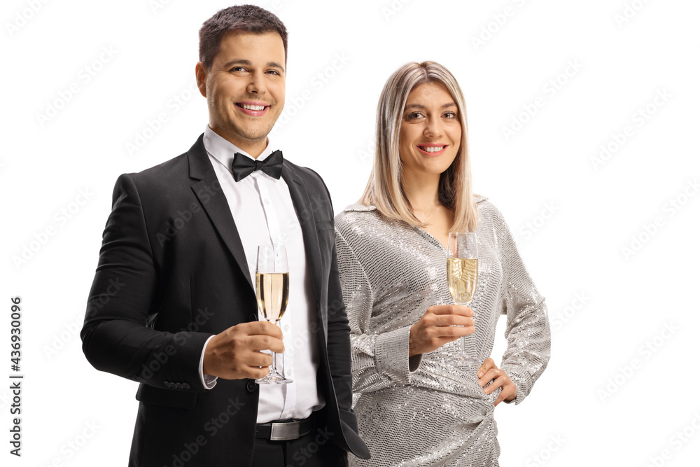 Young man and woman in elegant clothes holding glasses of sparkling wine Young man and woman in elegant clothes holding glasses of sparkling wine