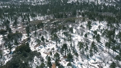 drone flying over snowy hill
