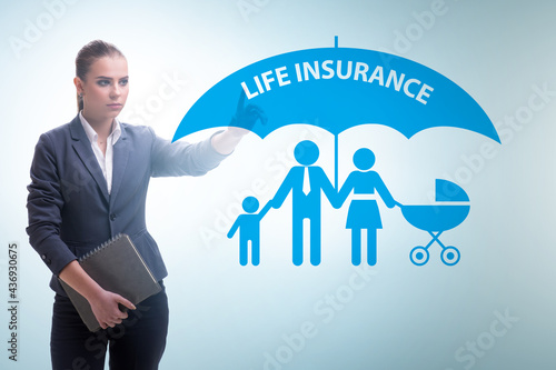 Life insurance concept with businesswoman pressing button