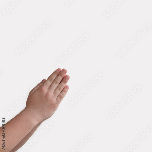 boy's hands folded for prayer