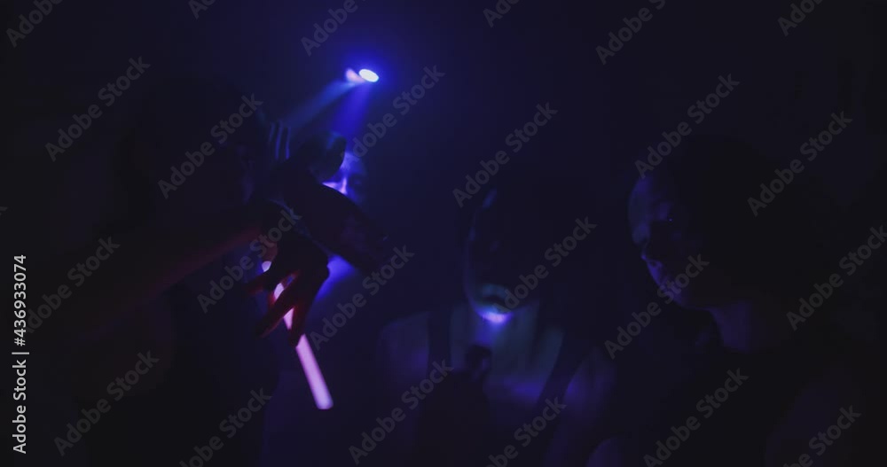 Showing their faces with the lights while dancing Showing their faces with the lights while dancing