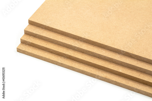 Raw MDF boards of brown color arranged in the shape of steps.