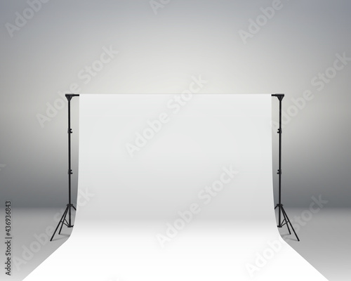 Professional photo studio interior. Photography tripods and racks and paper roll