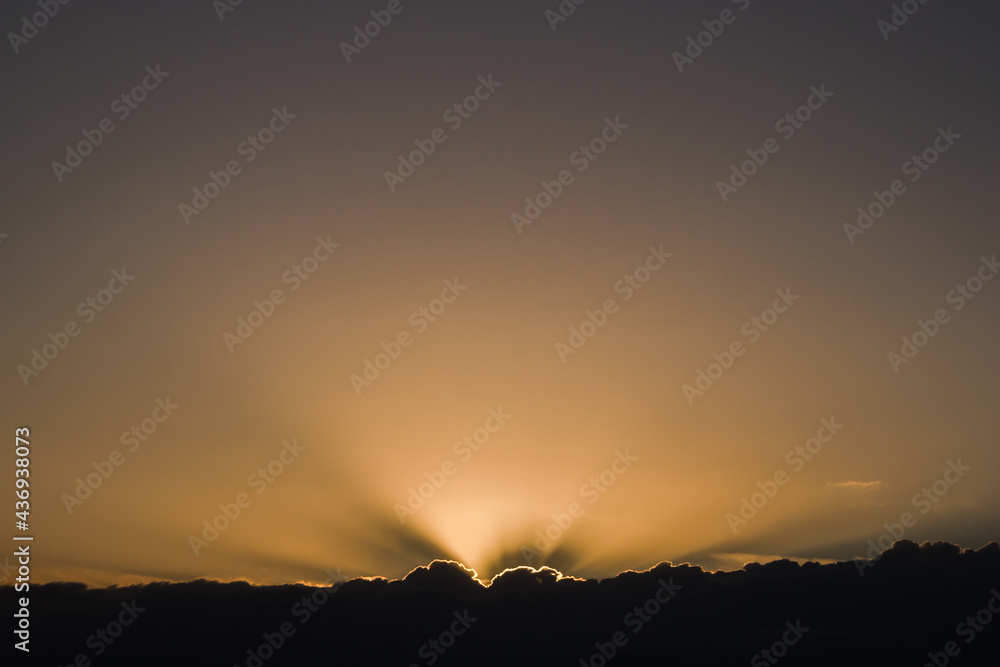 Rays of the sun coming out from behind the clouds