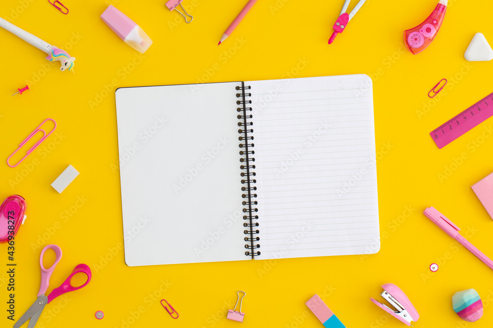School stationery and notebook on a yellow background. Top view with copy space. Flat lay. Back to school concept. School stationery and notebook on a yellow background. Top view with copy space. Flat lay. Back to school concept.