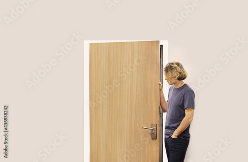 man opening the door .Inviting the guests.