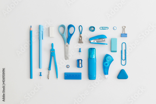 Obraz na płótnie Blue school stationery on a grey background. Top view. Flat lay. Back to school concept. w salonie