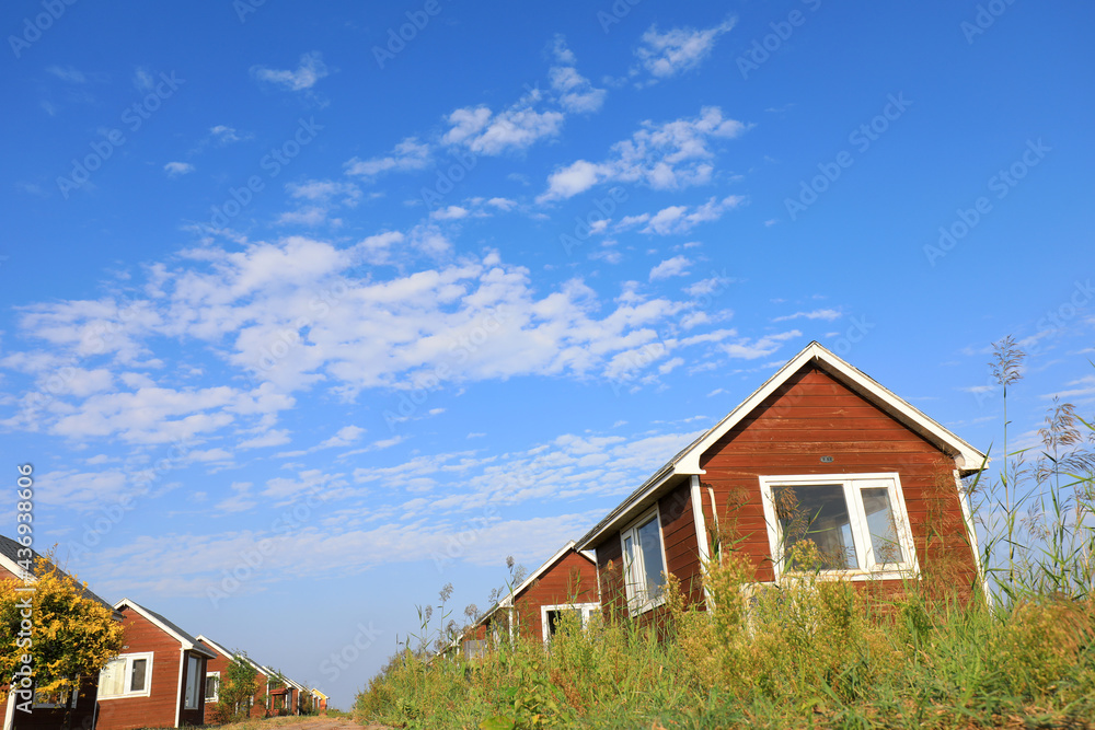 The wooden house in the background of blue sky The wooden house in the background of blue sky