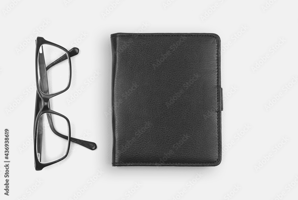 Office desktop with leather notepad and glasses, business workspace concept, copy space photo Office desktop with leather notepad and glasses, business workspace concept, copy space photo