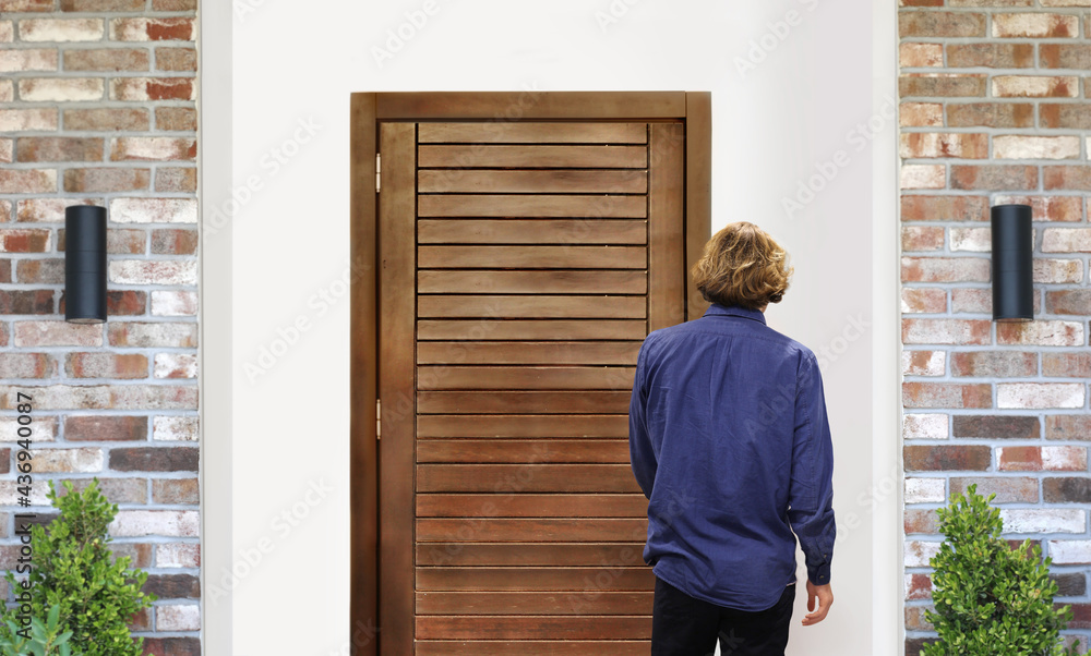 man opening the door .Inviting the guests. man opening the door .Inviting the guests.