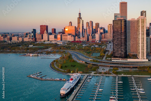 Aerial view of Dusable Harbour near Columbia Yacht Club with Chicago skyline in background at sunset, Chicago, Illinois, United States. photo