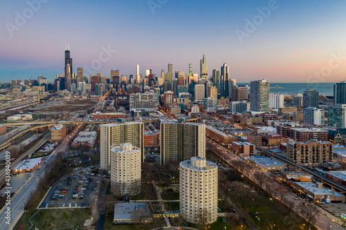 Aerial view of Chicago residential district near Park No. 540 with city skyline in background at sunset, Chicago, Illinois, United States.