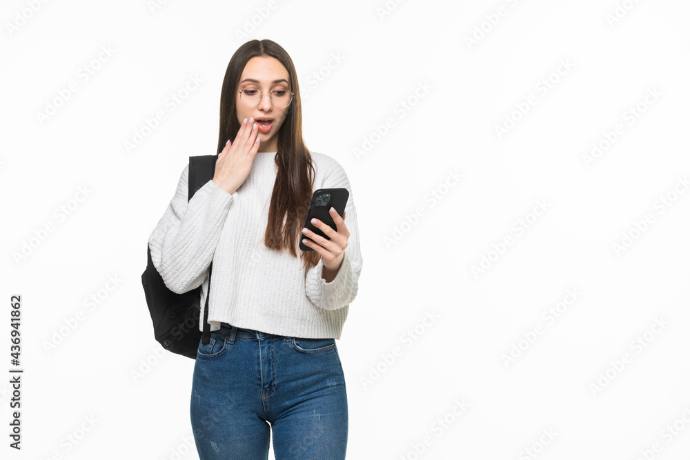 Young pretty woman using cell phone isolated on white background Young pretty woman using cell phone isolated on white background