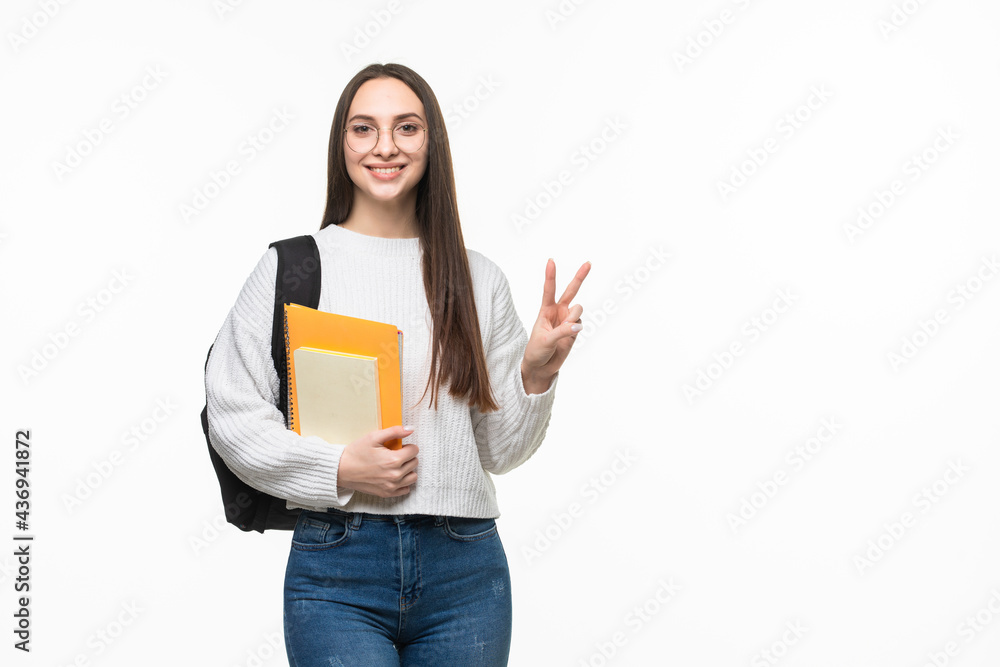 Student with books and backpack with peace gesture on white background. Preparing for exam Student with books and backpack with peace gesture on white background. Preparing for exam