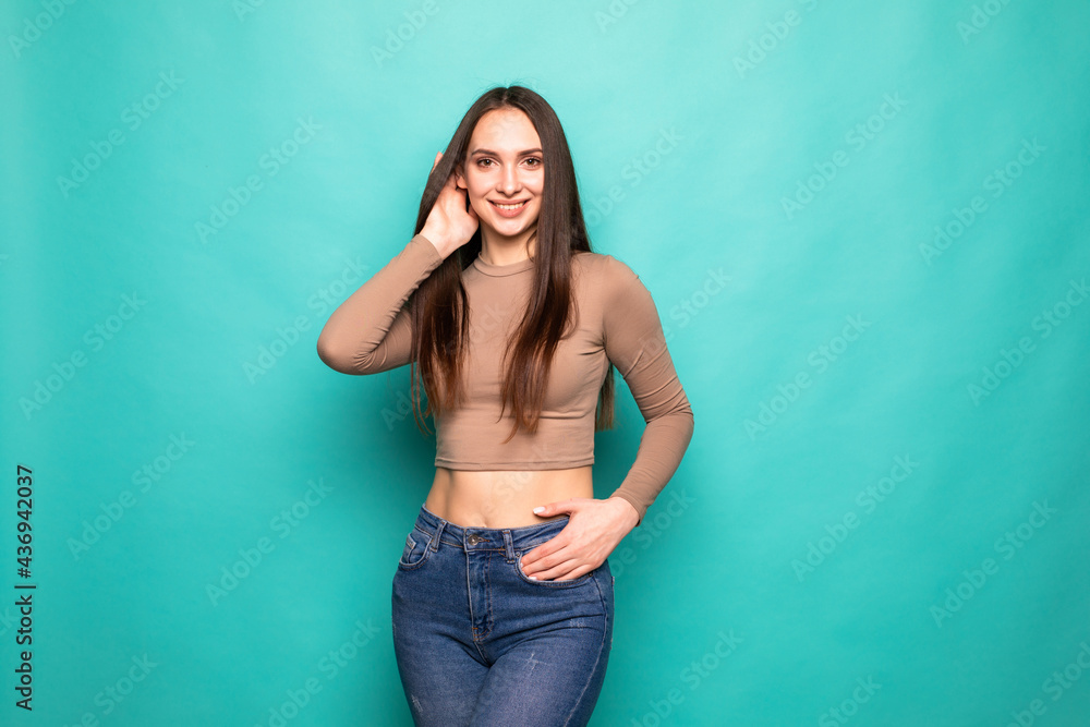Advertising concept. Portrait of young woman isolated on vivid turquoise background Advertising concept. Portrait of young woman isolated on vivid turquoise background