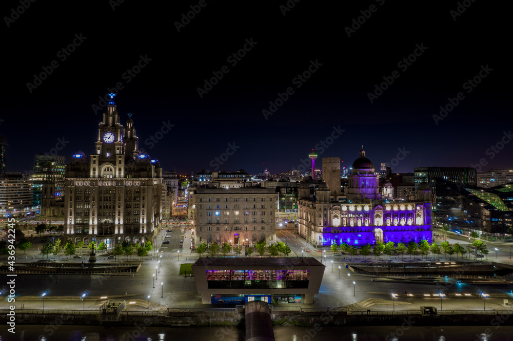Aerial shot of the 3 Graces on the Liverpool pierhead at night