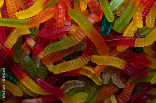 Multicolored jelly worm candies background