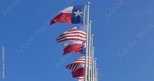 Wallpaper Mural A row of Texas and American flags fluttering in the wind Torontodigital.ca